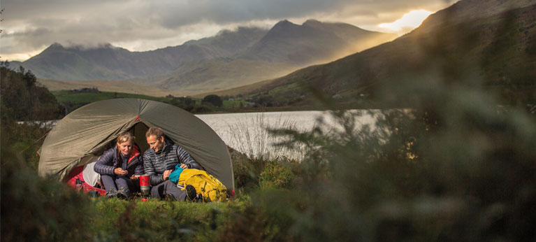 man and woman wild camping